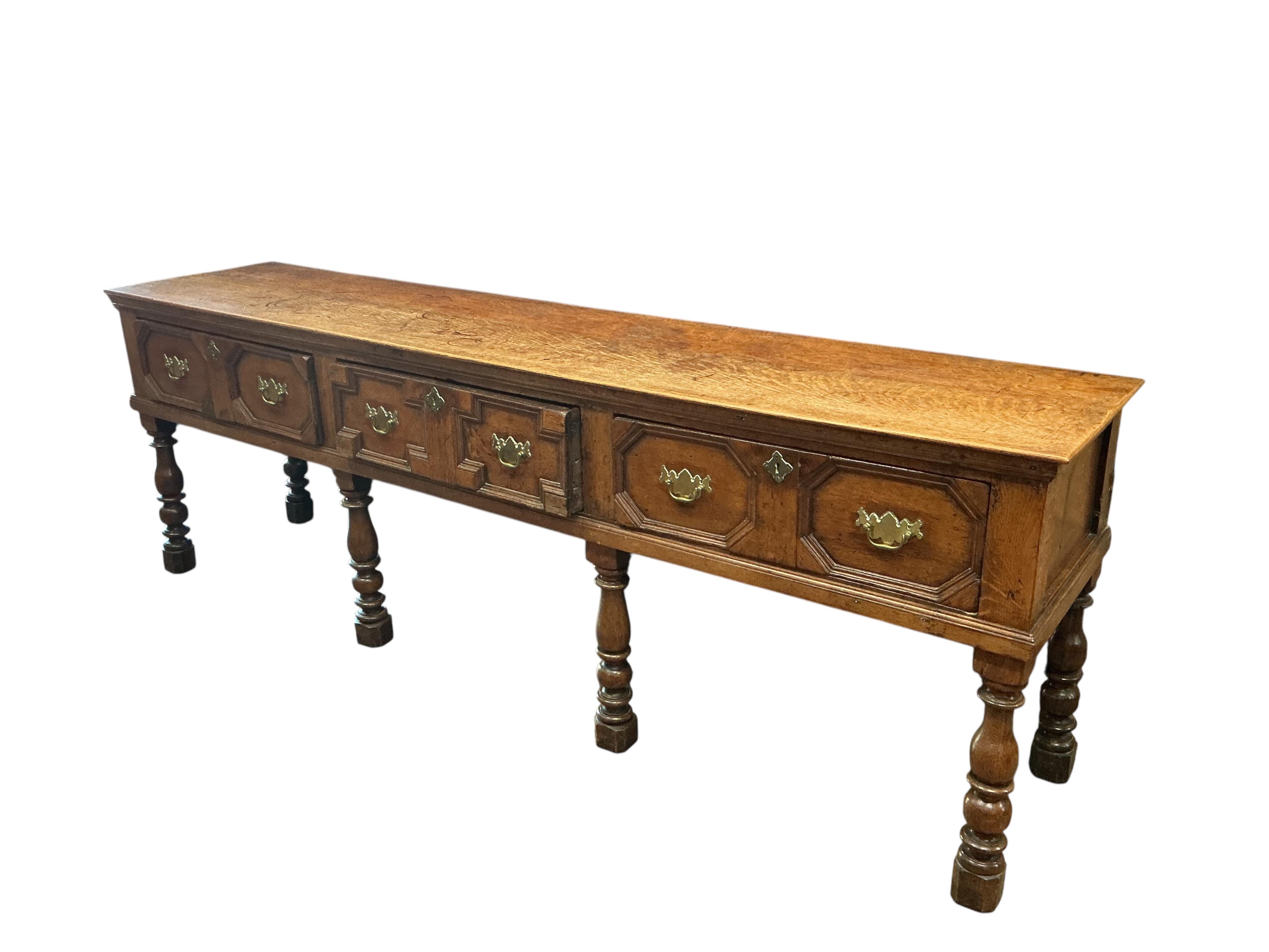 A William III and later oak low dresser, width 234cm, depth 50cm, height 78cm